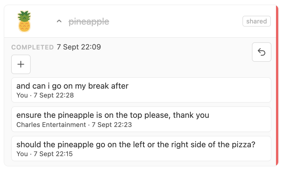A task expanded to show a conversation between two team members